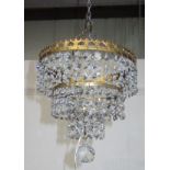 A gilt metal and cut glass waterfall chandelier, height 22cm, diameter 20.5cm.