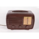 A brown bakelite Little Maestro radio, height 20cm, width 30.5cm, depth 14cm.