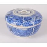 A Japanese blue and white bowl and cover, 20th century, decorated with stylised flowers,