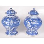 A pair of Chinese blue and white porcelain baluster vases and covers, 19th century, height 31cm,