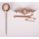 An Edwardian gold bar brooch set a sea horse carved hard stone cameo and a cameo pin.