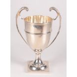 A silver trophy with twin high scrolling handles and square foot, 11.6oz, maximum height 21.8cm.