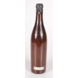 A mahogany bottle to commemorate the launching of a submarine,