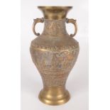 A Chinese polished bronze baluster vase, early 20th century, decorated with figures on a balcony,