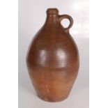 A large dark brown stoneware bellarmine jug, 18th century, height 39cm, width 21cm.