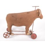 A late Victorian sit upon, steerable, soft stuffed bull, replacement outer fabric,