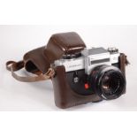 A Leitz Leicaflex SL camera, with Summicron lens No.12564K, in original brown leather case.