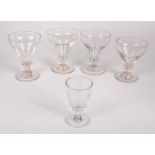Four glass rummers, 19th century, tallest height 14.5cm, and an ale glass, height 11.5cm.