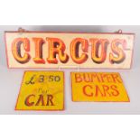 A painted wooden circus sign, 19 x 65.5cm and a cardboard 'Bumper Car' sign and a similar '£3.