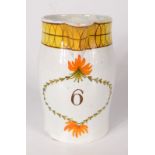 A pearlware jug, early 19th century, painted with a floral wreath enclosing the number 6,