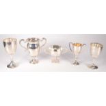 A Mappin & Webb silver twin handled cup, together with four other silver cups, 25.2oz.