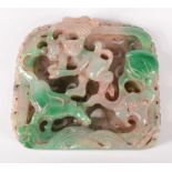 A Chinese carved jade panel showing a lemur, a lily,