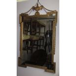 A reproduction gilt framed wall mirror.
