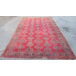 An Ushak carpet, the madder field with five vertical rows of polychrome medallions,
