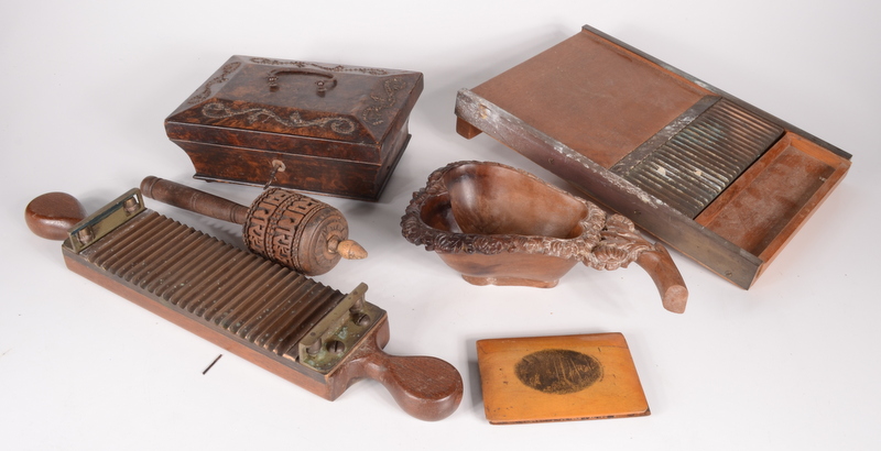 A Palais Royale box, a pill board, a prayer wheel, Mauchline book covers and a carved bowl.