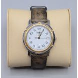 A Hermes gentleman's gilt and stainless steel dated wristwatch numbered CL6.720 1512956 diameter 35.