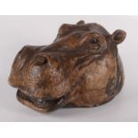 A resin model of a hippopotamus head, height 18cm, width 17cm, depth 34cm.