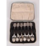 A set of six shooting prize silver spoons, cased.
