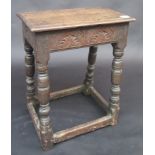 A 17th century oak joint stool, the rail lunette carved to each side, width 45cm, height 53.