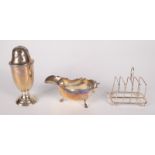 A silver sugar caster, a silver toast rack and a silver sauce boat, 9.5oz.