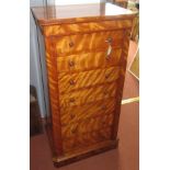 A Victorian satin birch Wellington chest of drawers, with seven drawers and a plinth base,