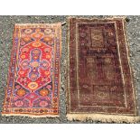 A Belouch rug, the indigo field with four rectangular medallions,