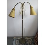 A brass standard lamp, 1960s/70s, with twin shades, height 125.5cm, width 77cm.