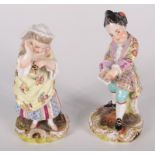 A pair of continental porcelain figures of a boy and a girl, late 19th/early 20th century,