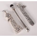 Two silver needle cases and a silver cayenne pepper spoon.