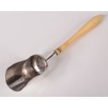 A William Pugh silver tea scoop with delicate turned ivory handle.