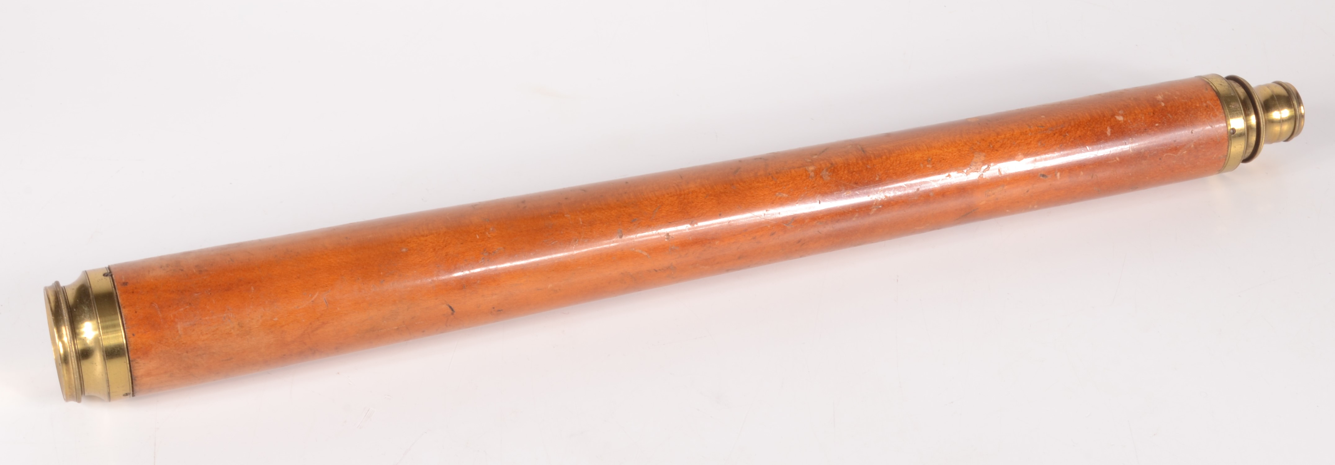 A midshipman single draw brass and wood telescope, 19th century, extended length 63cm.