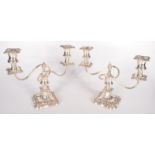 A pair of modern silver plated candelabra, height 24.5cm, width 28.5cm.