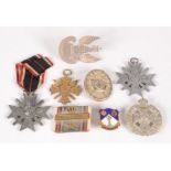 Eight miscellaneous badges and medals,