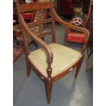 A mahogany chair, the reeded open arms on vase turned supports, the ladderback reeded,