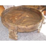 An Indian carved hardwood circular seed table, height 29.5cm, diameter 78cm.