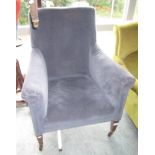 A blue upholstered armchair.
