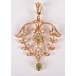 A peridot and pearl 15ct gold pendant.