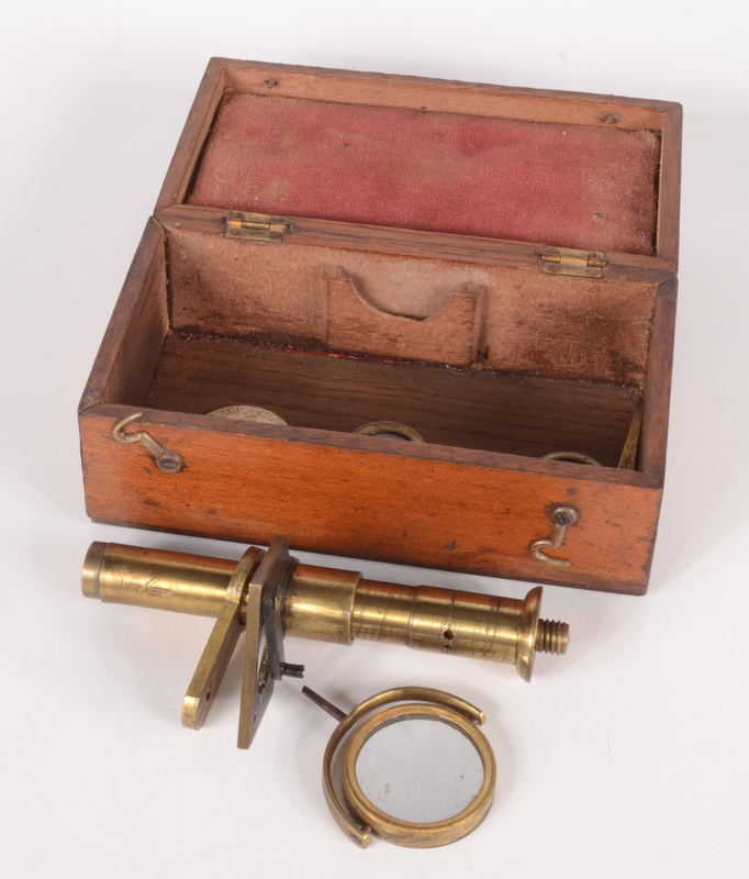 A small brass botanical microscope, by R. Field & Son, Birmingham, height 12cm, in a mahogany case.