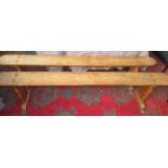 A pair of beech wood benches, early 20th century, length 200cm, height 48cm, depth 38cm.