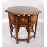 An Indian ivory inlaid octagonal occasional table, 19th century, with a folding base, height 52cm,