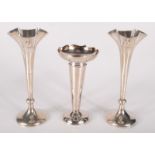 A pair of late Victorian filled silver spills and an EPNS spill.