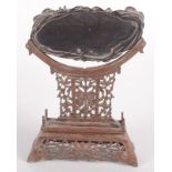 A Chinese hardwood stand, 19th century, carved with flowers and scrolling vines, height 22cm,