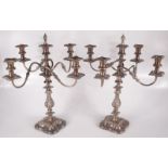 A pair of silver plated four branch candelabra with flambeau finials, height 54cm.