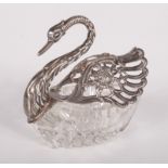 A continental cut glass salt in the form of a swan with silver head and silver hinged wings,