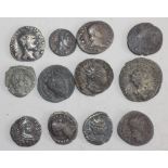 Twelve silver and other Roman coins.