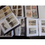 A large collection of foreign country postcards housed in six modern albums some laid down.