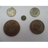 Two large bronze medals,