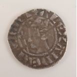 An early hammered silver coin, long cross with monarch before a sword.
