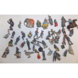 A quantity of lead figures including Cococubs animals and Felix the Cat, poor condition.