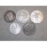 Five World silver coins.